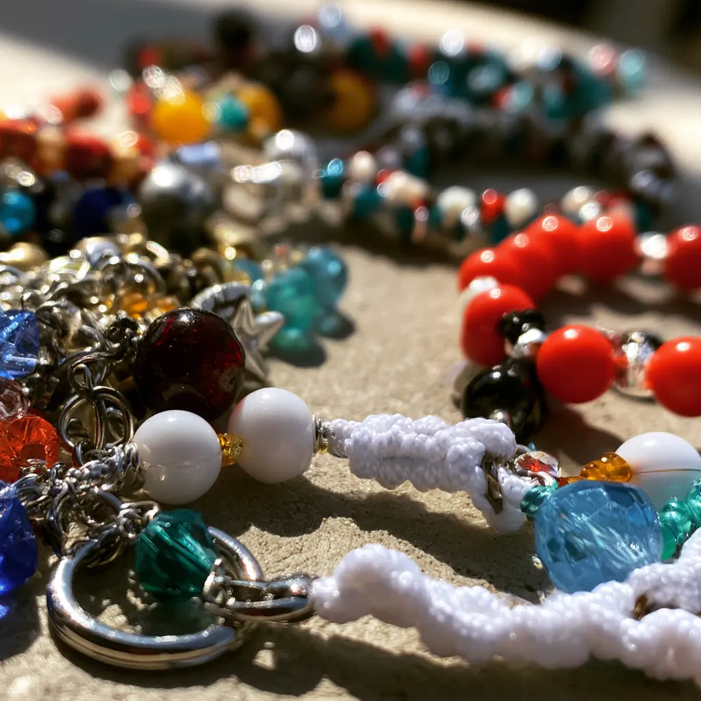 Close-up of colourful beaded charms and bracelets